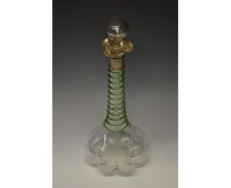 An Edwardian Art Nouveau bulbous decanter, the neck applied with a spiralling band of green, globular drop-in stopper, silver