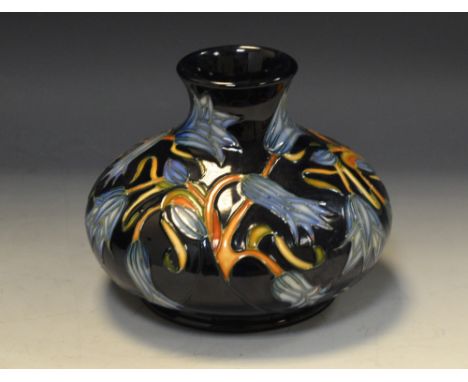 A contemporary Moorcroft Carillion Blue pattern compressed ovoid  vase, designed by  Sian Leeper, tube lined with stylised fl