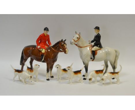 A Beswick hunting set, comprising a mounted huntsman, model no. 1501, a huntswoman mounted on a dapple grey, model no. 1730, 