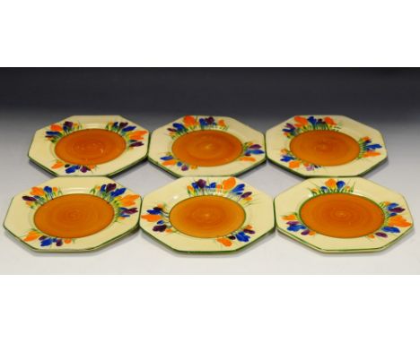 A set of six Clarice Cliff octagonal plate, painted with crocuses, in orange, blue and purple, green line rims, 14cm wide, pr