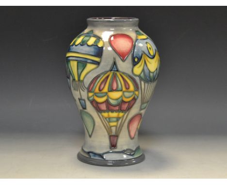 A contemporary Moorcroft Balloons pattern baluster vases, designed by Jeanne McDougall tube lined with hot air balloons, in c