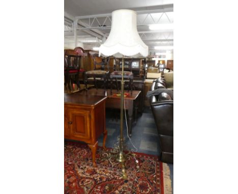 A Good Quality Brass Rise and Fall Standard Lamp on Tripod Base with Shade