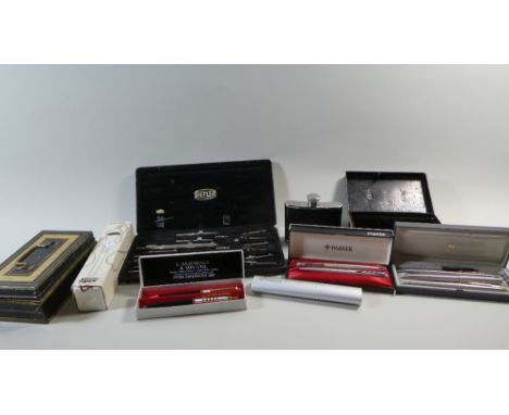 A Tray of Curios to Include Six Boxed Parker Pens Including Slinger, Two Cash Tins, Hip Flask and Drawing Set