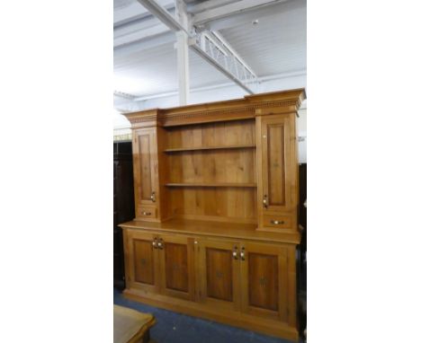 A Hubka and Co. Inlaid Kitchen Dresser, The Base with Panelled Doors to Two Cupboards, Raised Two Shelf Plate Rack Flanked by