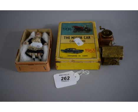 A Vintage Motorcar Board Game, Novelty Coffee Grinder Tape Measure, Novelty Watermill Tape Measure and a Small Boxed Doll