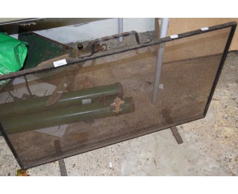 An iron fire screen