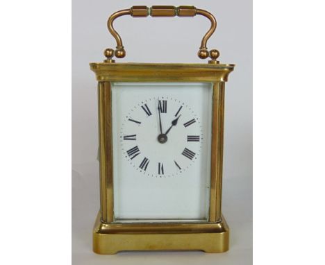 Brass carriage clock in cornice case with enamelled dial, the back plate engraved with a striding lion and the intials JPFA, 