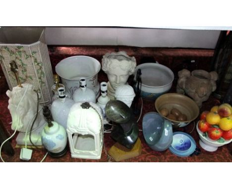 A collection of various ceramic lamp bases, a jardiniere with relief moulded decoration, a stick stand with relief moulded wo