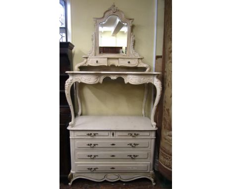 An oak commode with later cream painted and distressed finish and gilt detail, fitted with three long and two short drawers o