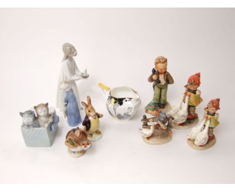 A collection of four Hummel figures of children, two Beswick Beatrix Potter figures of Mr Benjamin Bunny and Appley Dapply, b