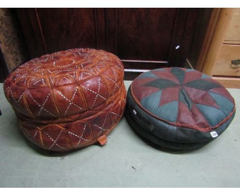 A vintage stitched leather pouffe with geometric pattern detail and a further shallow pouffe in soft leather