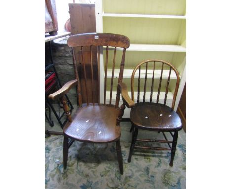 A 19th century Windsor stick back elbow chair with elm wood seat, together with a further hoop back Windsor chair