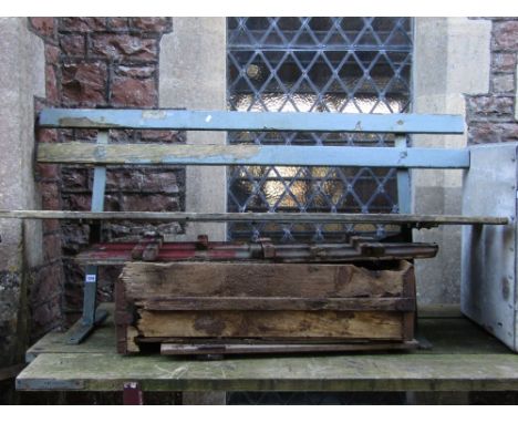 A two to three seat garden bench with open painted and weathered wooden slatted seat and back raised on simple angular steel 