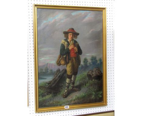A 19th century continental oil painting on canvas showing a full length study of a young boy in Tyrolean style costume, playi