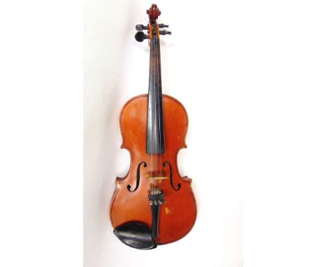 An antique violin by London Violin Co Ltd, further stamp for Antonius Stradivarius, within a baize lined case.