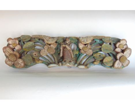 Far Eastern carved wooden panel with deep relief of a sage flanked by two birds sat on flower heads with further leaves and f