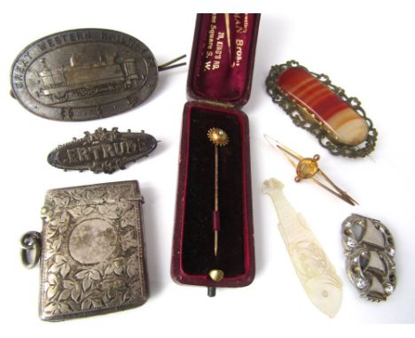 A yellow metal brooch set with faceted citrine, a yellow metal and seed pearl stick pin, silver vesta case, a GWR cap badge, 