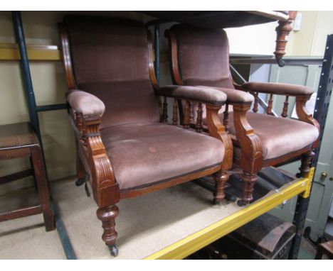 A late Victorian oak three piece drawing room or parlour suite comprising a three seat sofa and a pair of matching armchairs,