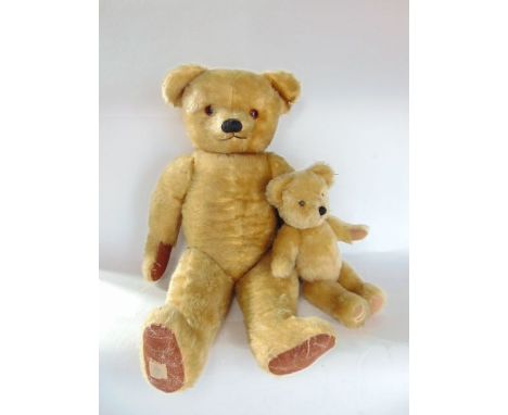 A Chad Valley mohair straw stuffed Teddy Bear with articulated limbs and glass eyes together with a smaller Merrythought Bear