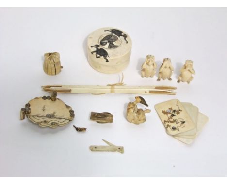 An  ivory trinket box with engraved elephant detail, three wise monkeys, notebook, etc