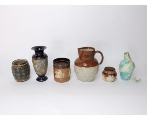 A collection of Doulton wares including a Slater's Patent vase and similar tobacco jar base, a further relief moulded tobacco