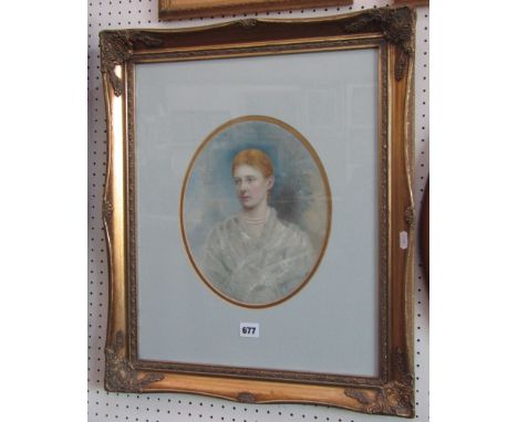 A late 19th century bust length portrait of oval form showing a fair haired young woman in a pearl necklace and gauzy shawl, 