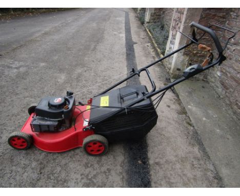 A Champion rotary petrol lawn mower R484SP
