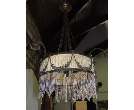 An antique hanging boudoir lamp fitted with four scrolled branches centrally fitted with a centre light, framed by a pleated 