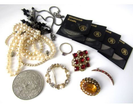 A 9ct crescent shaped garnet and seed pearl brooch together with five crowns and a small quantity of costume jewellery