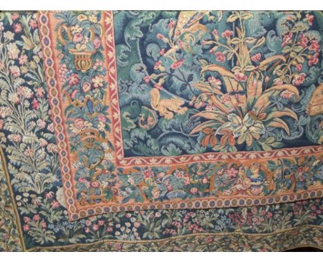 Belgian machine woven tapestry in the William Morris style decorated with birds amidst foliage with autumnal borders with fig