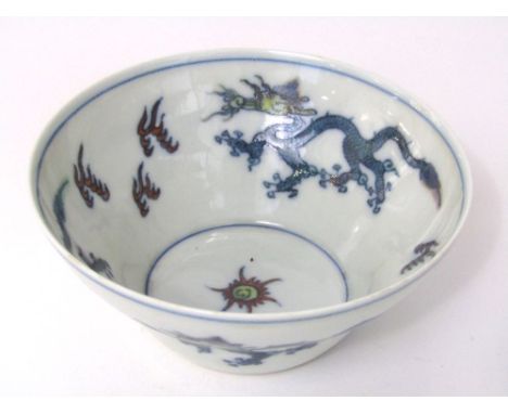A Chinese bowl with polychrome painted dragon and flaming pearl detail and six character mark to base, 11cm diameter