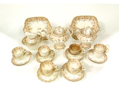 A collection of mid 19th century tea wares with gilded fruiting vine detail comprising tea pot, covered sucrier, slop bowl, m