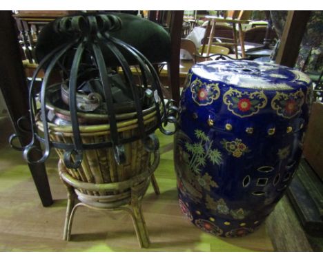 A Chinese style ceramic garden seat of barrel form with cobalt blue ground and applied detail together with a 19th century co