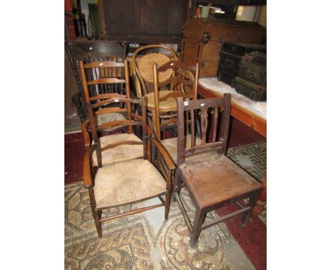 A collection of seven 19th century and later chairs to include a vintage bentwood rocking chair, three ladder back chairs of 