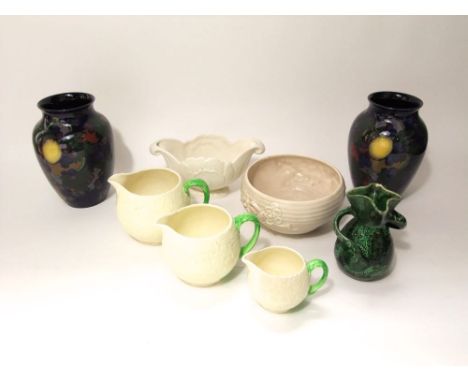 An early 20th century Barum of Barnstaple green glazed vase with asymmetrical handles and stylised fish decoration and incise