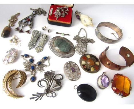 An interesting collection of costume jewellery including a silver amethyst pendant and brooch, a carved bog oak locket, etc