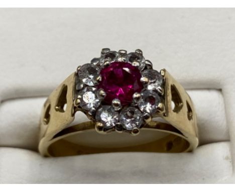 9ct yellow gold ladies dress ring with large pink stone surrounded by cz’s, size J 3.3g