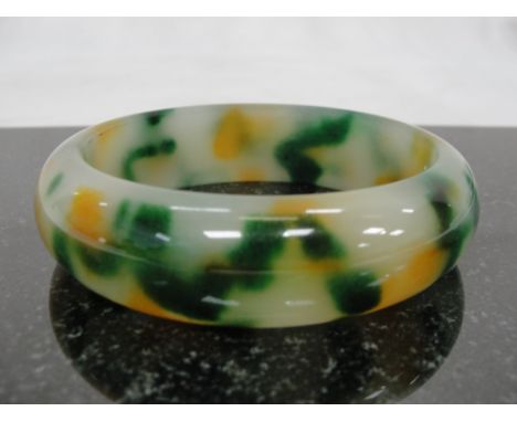 A Yellow, Green and White Jadeite Bangle