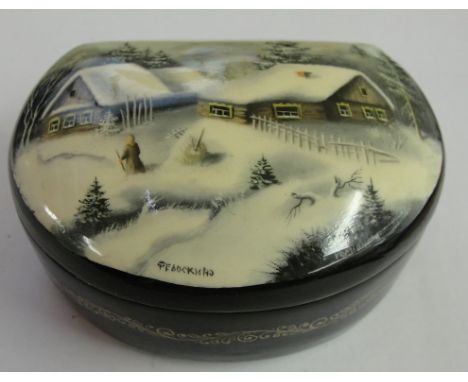 A painted Russian box with lacquered case; snow with a mother of pearl moon.