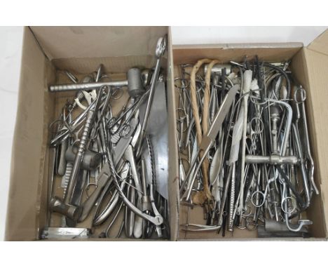 Two boxes of stainless steel surgery tools to include; trepanning drill, saw, etc.