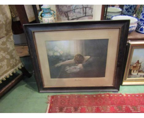 A print of lady mourning entitled "Her Cross", framed and glazed, 34cm x 47cm