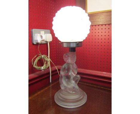 An Art Deco 1930's frosted glass lamp in the form of a kneeling lady with globular glass shade, 38cm high