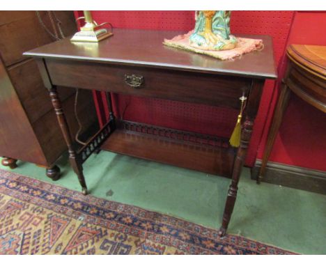 An Arts &amp; Crafts walnut rising top with drop down frieze writing table having a fitted interior and key on ring turned le