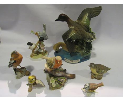 A Ducks Unlimited Kentucky Bourbon Whiskey bottle, three Crown Staffordshire bird figures and three Goebel bird figures inclu