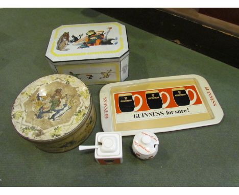 A selection of vintage Guinness advertising merchandise including a tray, two Carltonware mustard pots and two biscuit tins a