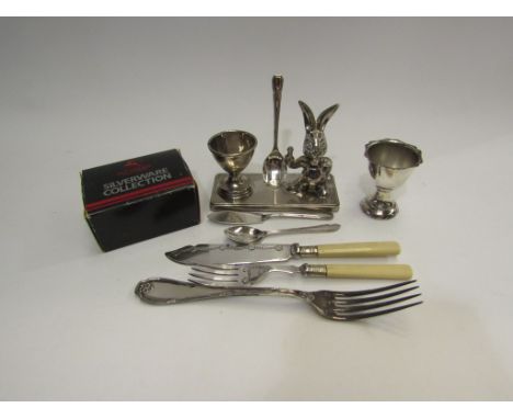 A selection of silver plated wares including flatware and egg cups and a fork marked 800