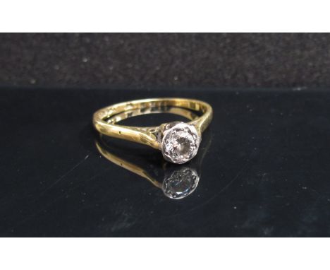 An 18ct gold platinum set diamond ring, worn. Size K, 2.2g