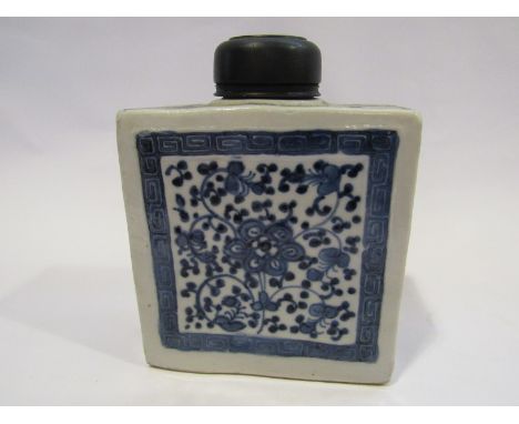 A 19th Century Chinese blue and white tea caddy with foliate panels