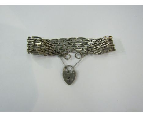 A silver gate bracelet with padlock clasp