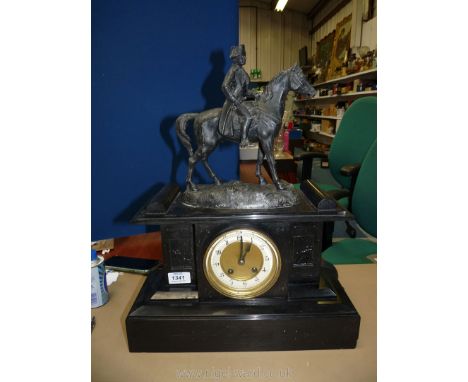 A highly polished black stone cased Mantle Clock having recessed panels depicting dueling soldiers in relief and surmounted b